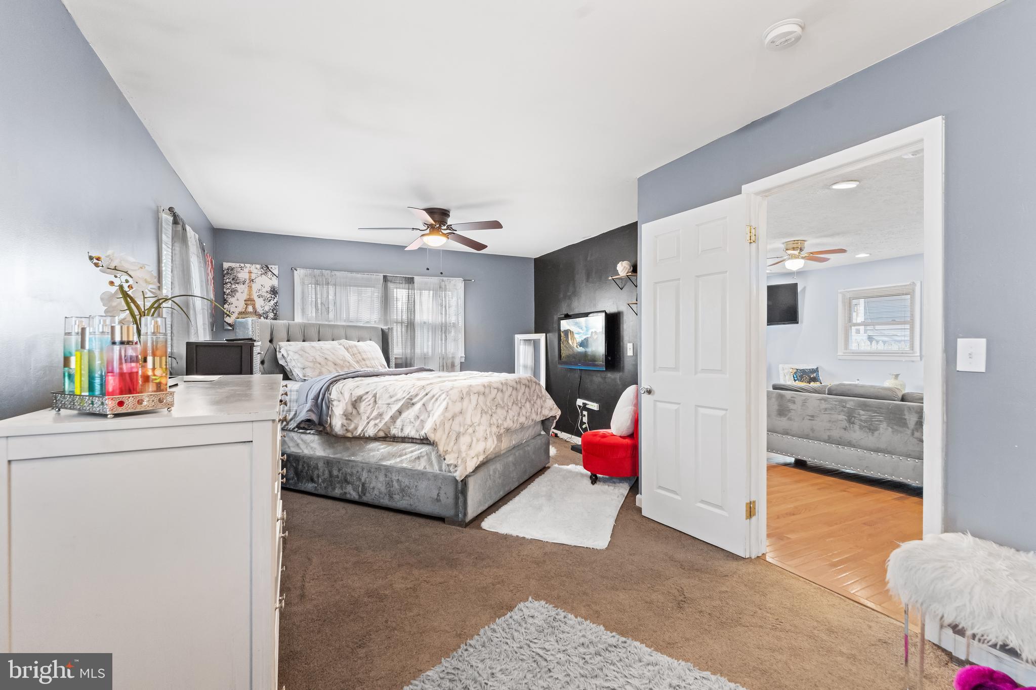 939 Clovis Avenue Capitol Heights, MD 20743 - Photo 10 of 25 a bedroom with a bed a couch and dresser