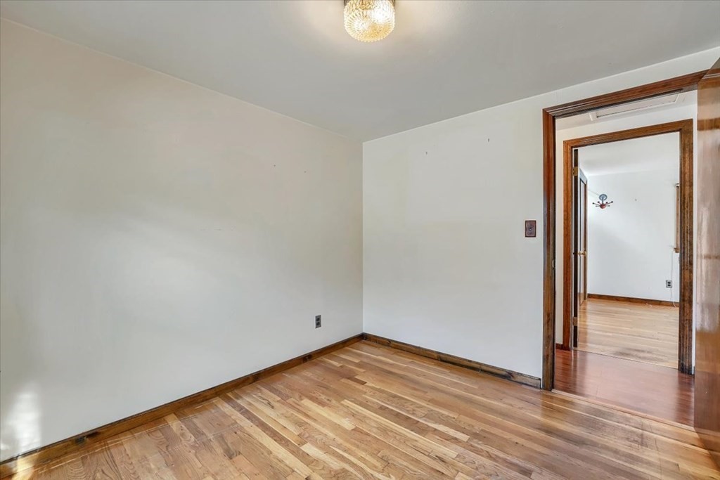 15 Joan Road Boston, MA 02136 - Photo 15 of 37 a view of empty room with wooden floor and fan