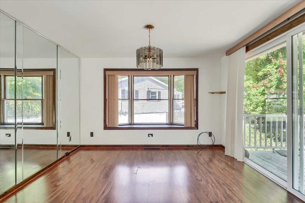 15 Joan Road Boston, MA 02136 - Photo 23 of 37 a view of an empty room with wooden floor and a window