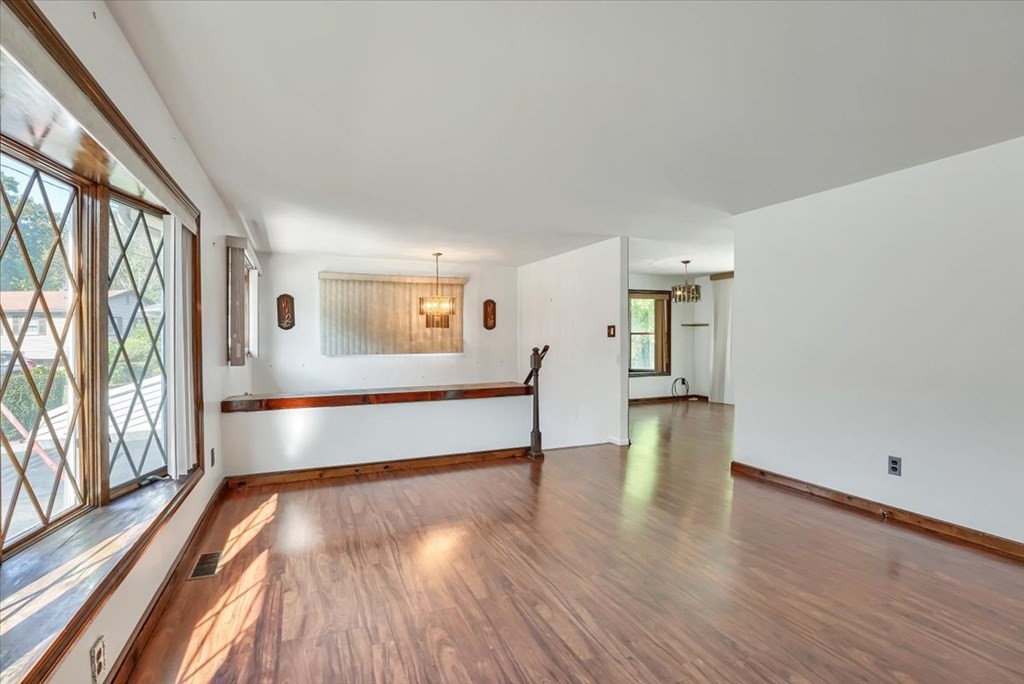 15 Joan Road Boston, MA 02136 - Photo 8 of 37 a view of an empty room with wooden floor and a window