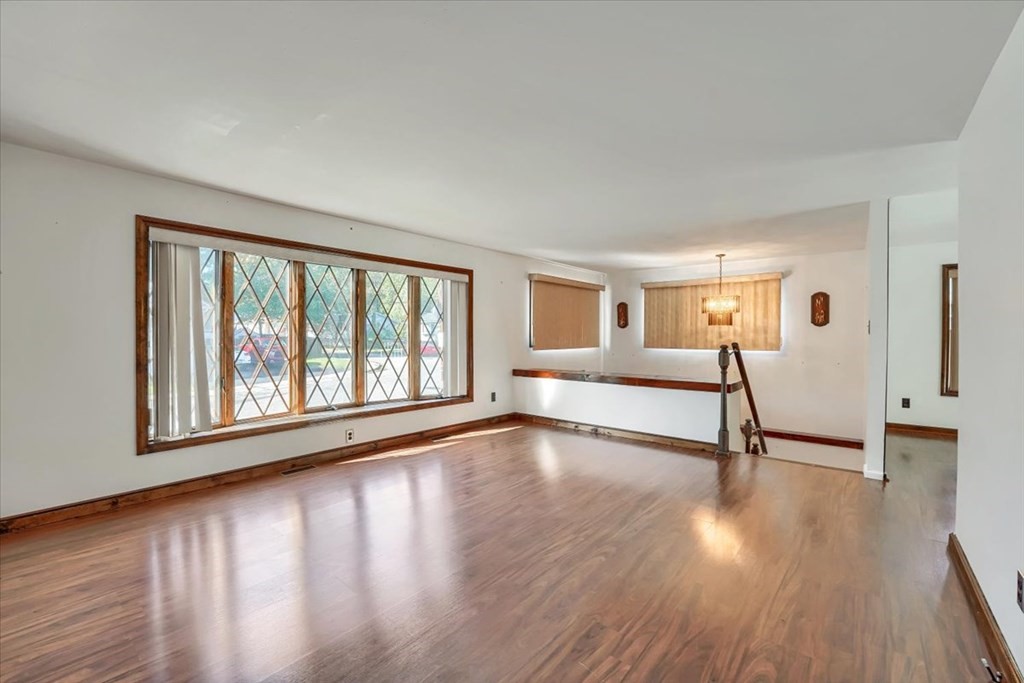 15 Joan Road Boston, MA 02136 - Photo 9 of 37 a view of an empty room with wooden floor and a window