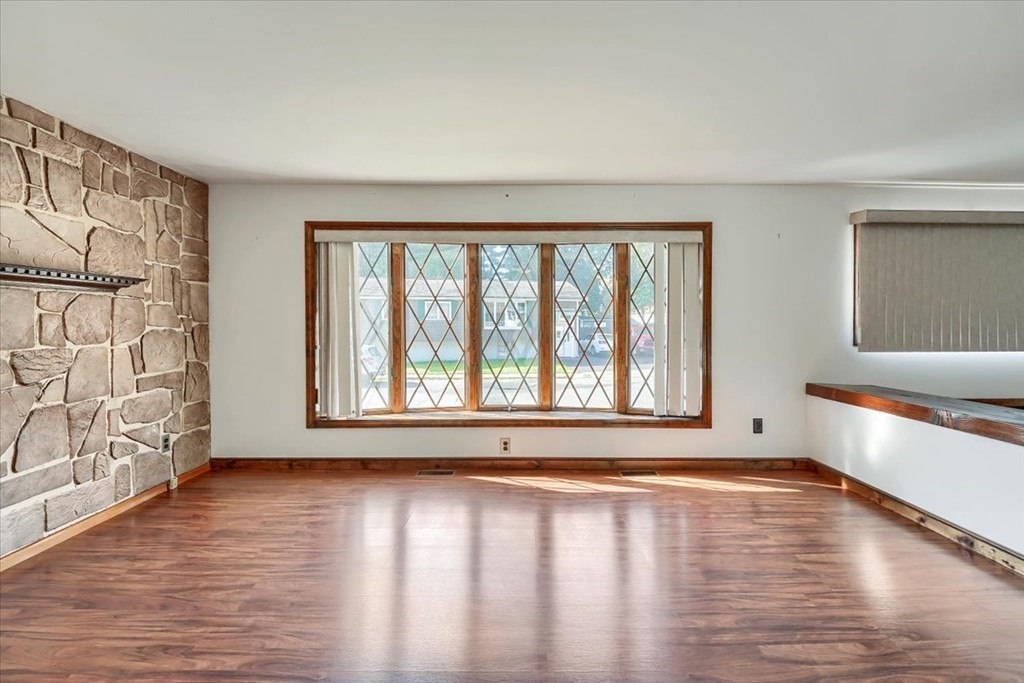15 Joan Road Boston, MA 02136 - Photo 10 of 37 a view of an empty room with wooden floor and a window