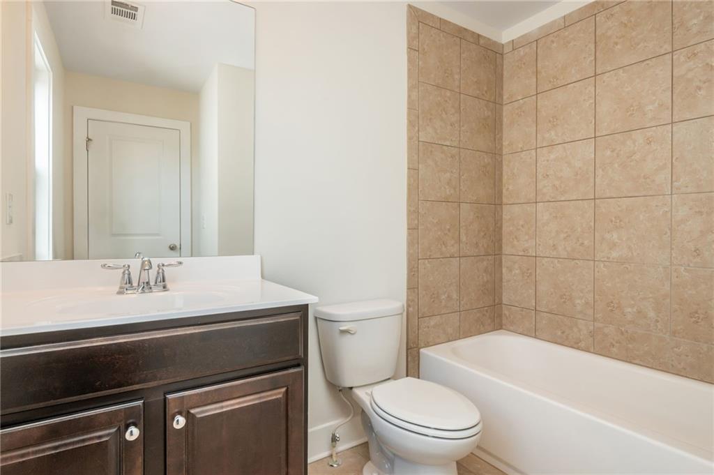 5914 High Hampton Lane Mableton, GA 30126 - Photo 28 of 32 a bathroom with a sink a toilet and shower