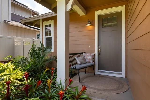 a backyard of a house with table and chairs