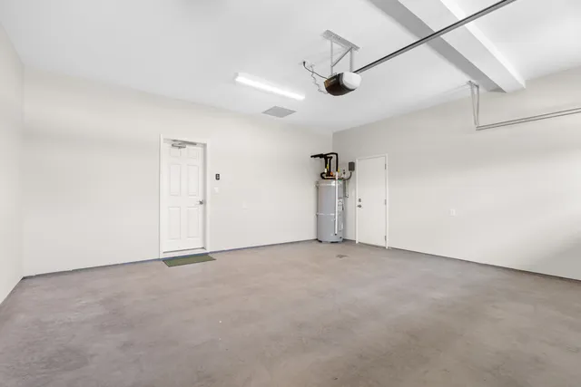 an empty room with a ceiling fan and painted walls