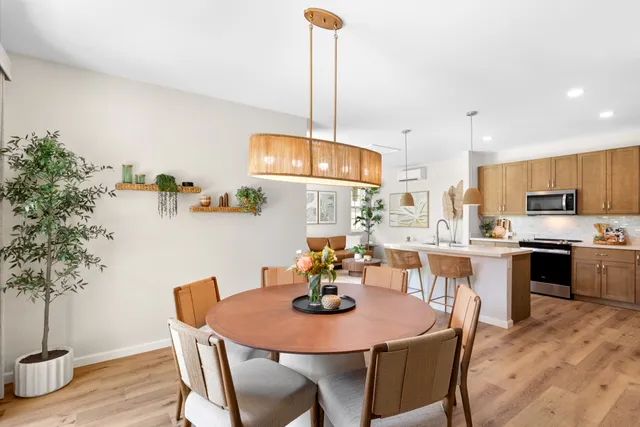 a view of a dining room with furniture and wooden floor