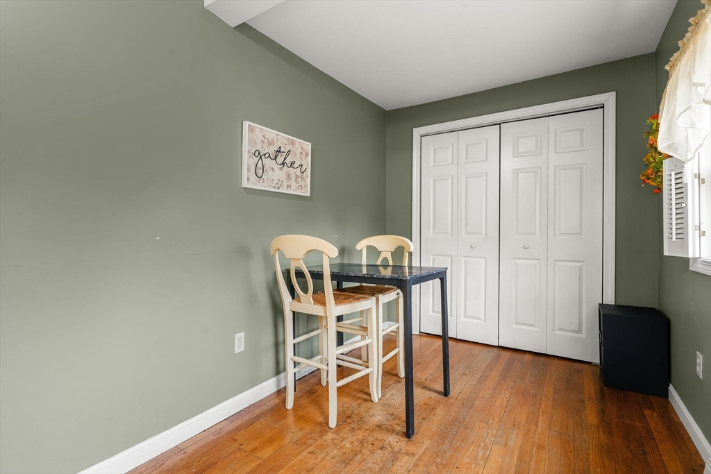 90 Loring Avenue Whitman, MA 02382 - Photo 14 of 22 a view of a dining room with furniture and wooden floor