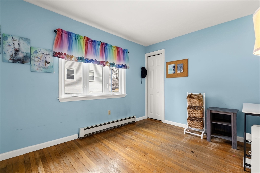 90 Loring Avenue Whitman, MA 02382 - Photo 15 of 22 a view of an empty room with workspace and wooden floor
