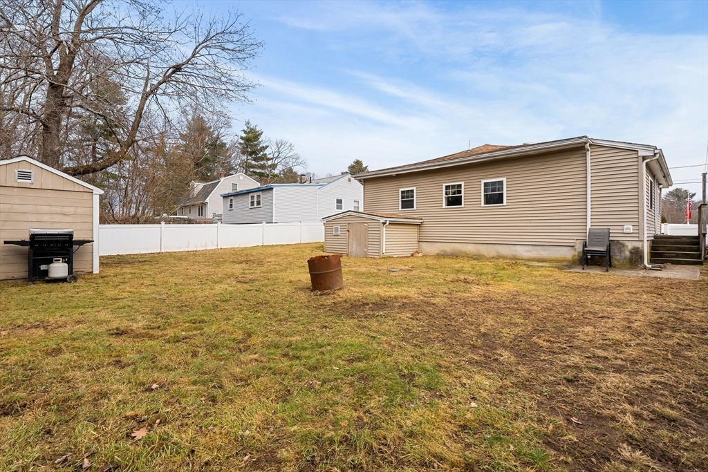 90 Loring Avenue Whitman, MA 02382 - Photo 19 of 22 a house view with a garden space