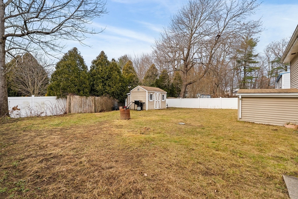 90 Loring Avenue Whitman, MA 02382 - Photo 20 of 22 a bathroom with a sink and a yard