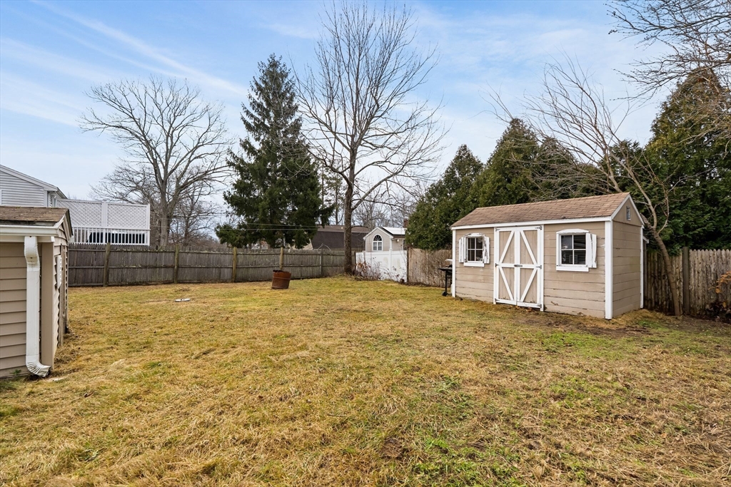 90 Loring Avenue Whitman, MA 02382 - Photo 21 of 22 a view of a yard with a house