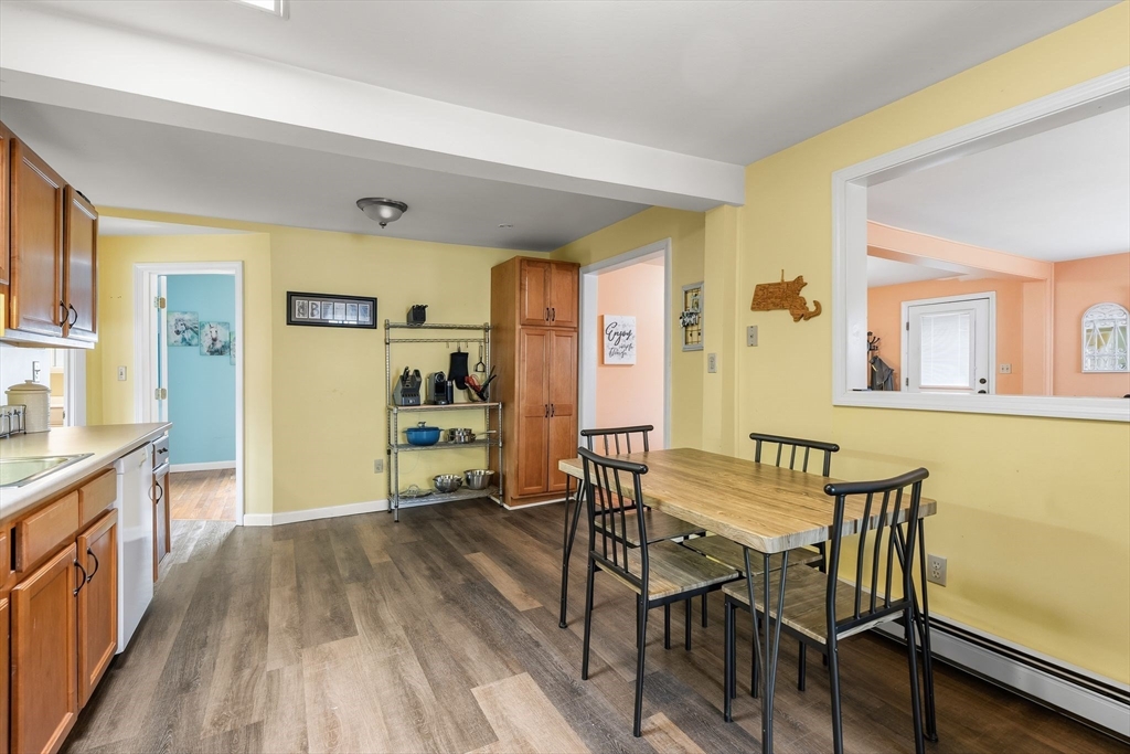 90 Loring Avenue Whitman, MA 02382 - Photo 9 of 22 a view of a dining room with furniture and wooden floor