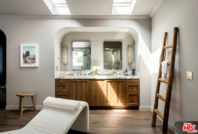 a view of living room with furniture and wooden floor
