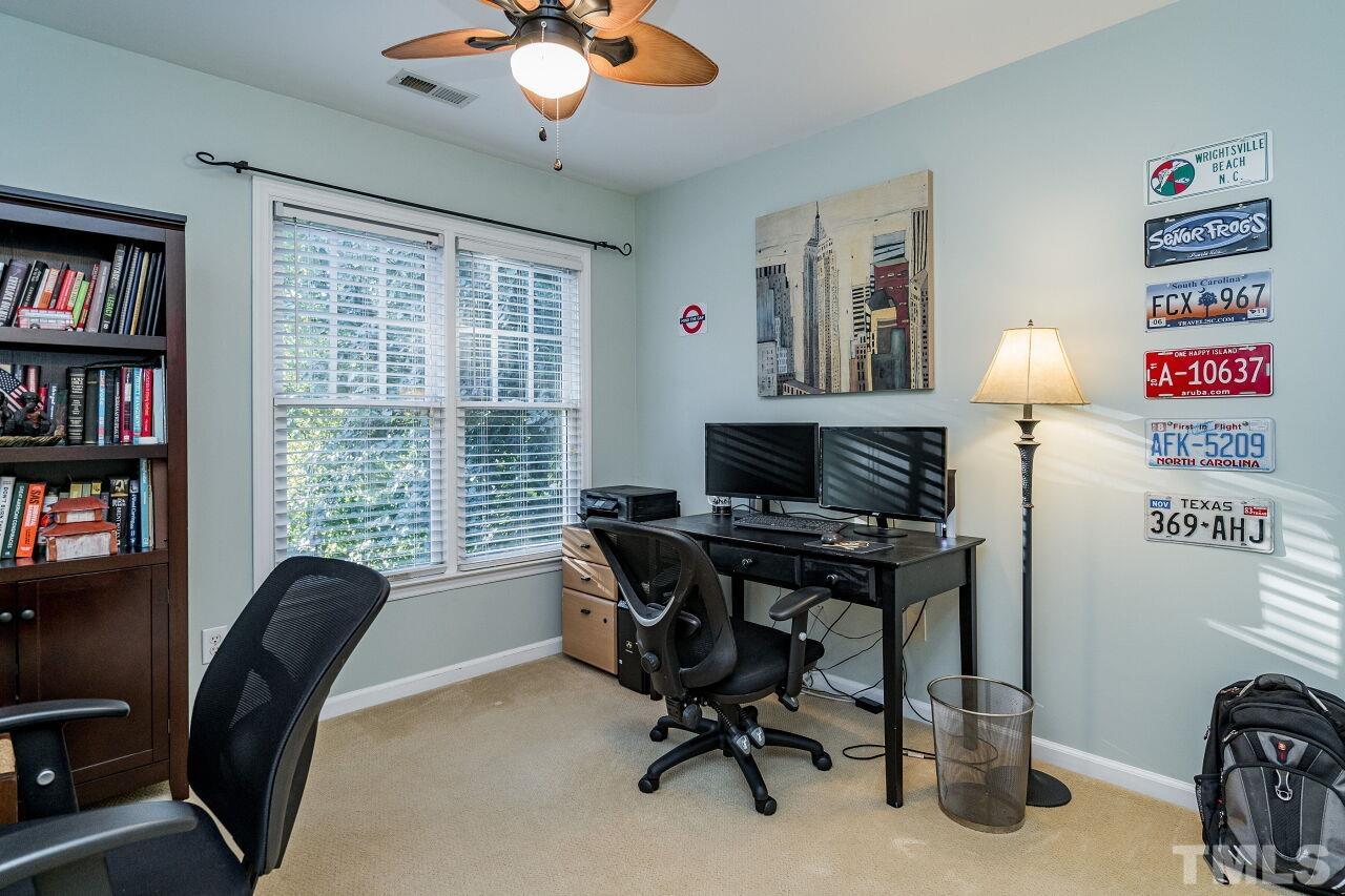 2201 Dunlin Lane Raleigh, NC 27614 - Photo 20 of 30 a view of a workspace with furniture and a window