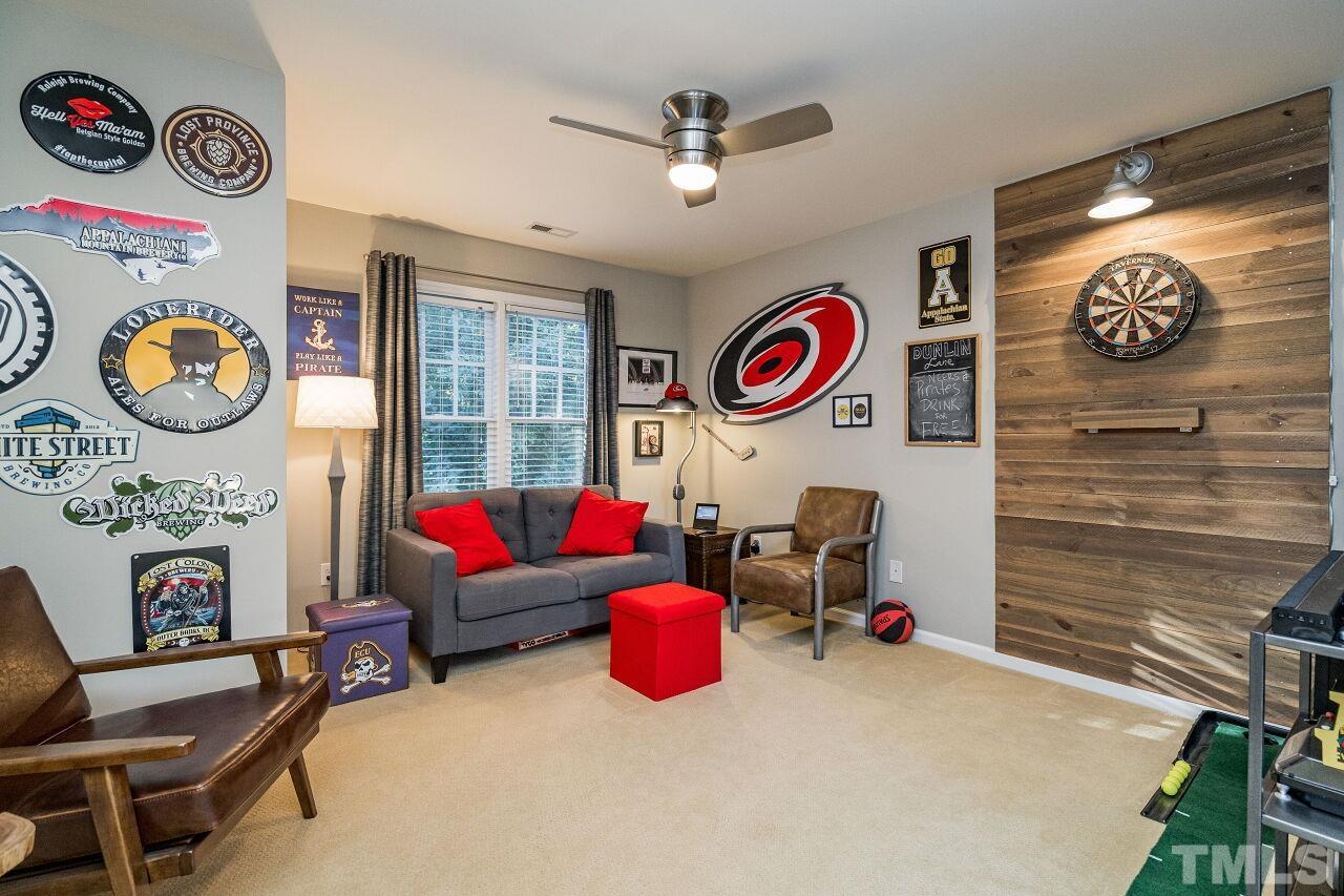 2201 Dunlin Lane Raleigh, NC 27614 - Photo 22 of 30 a living room with fireplace furniture and a window