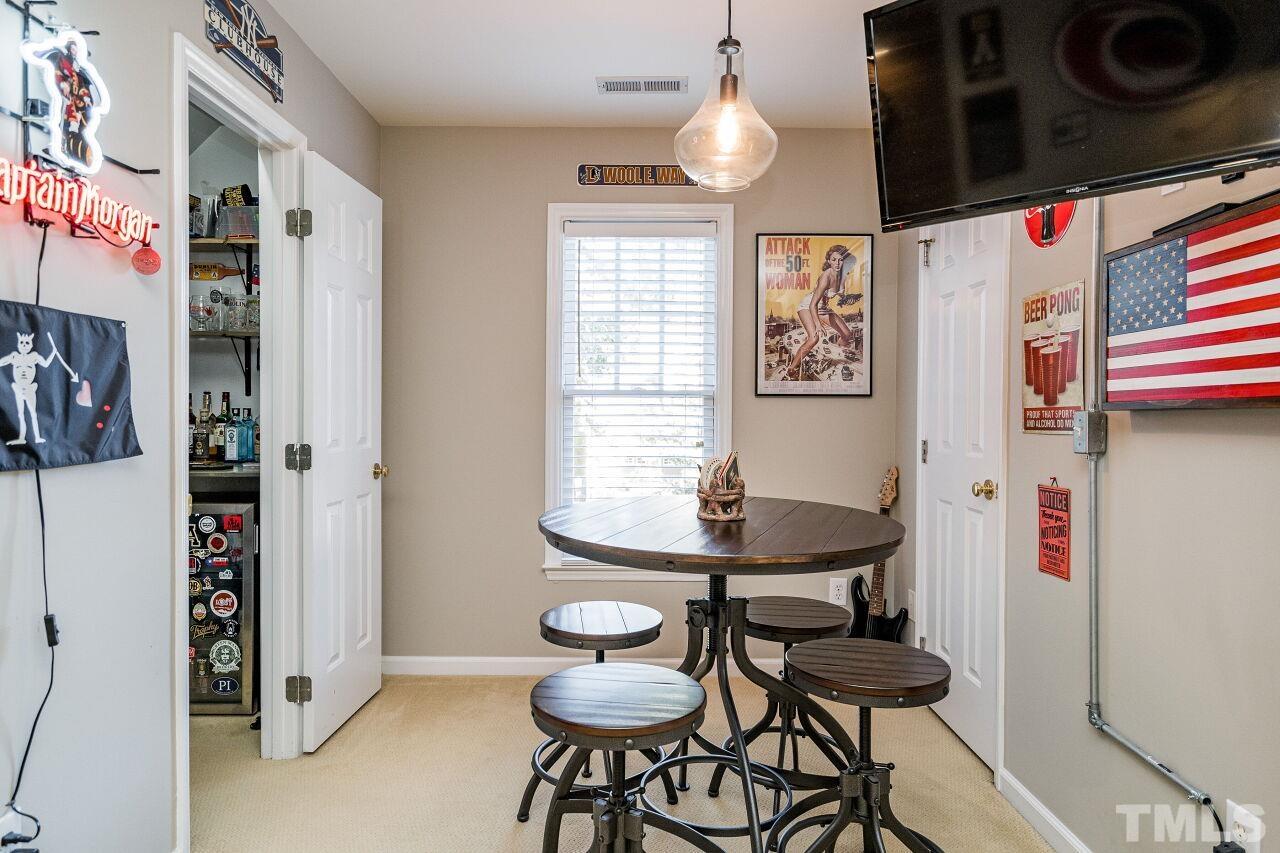 2201 Dunlin Lane Raleigh, NC 27614 - Photo 24 of 30 a view of a room with furniture and wooden floor