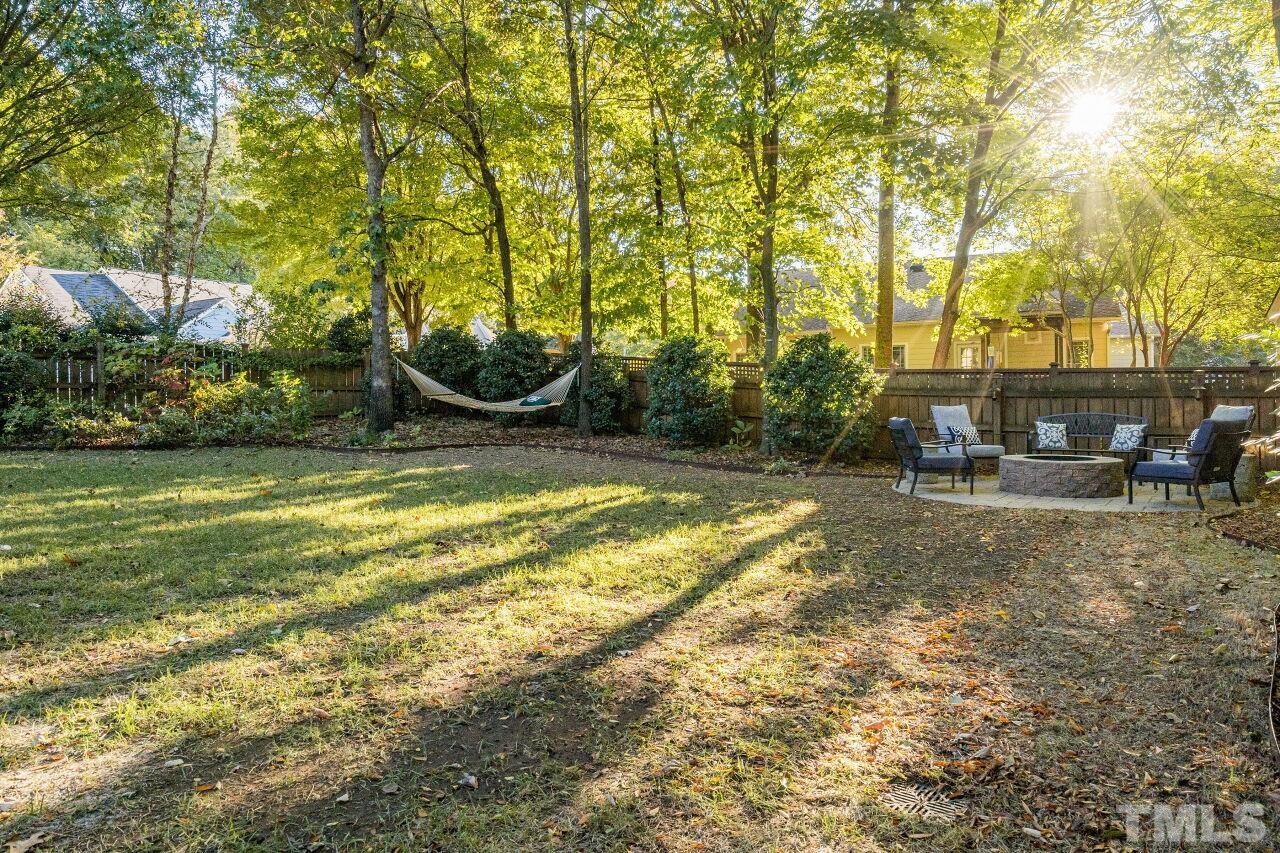 2201 Dunlin Lane Raleigh, NC 27614 - Photo 28 of 30 a view of swimming pool with lawn chairs and plants