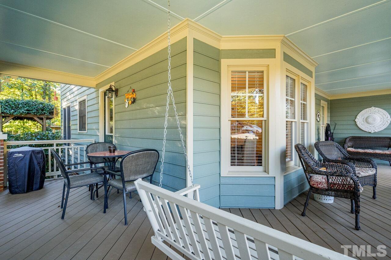 2201 Dunlin Lane Raleigh, NC 27614 - Photo 4 of 30 a balcony with wooden floor and outdoor seating