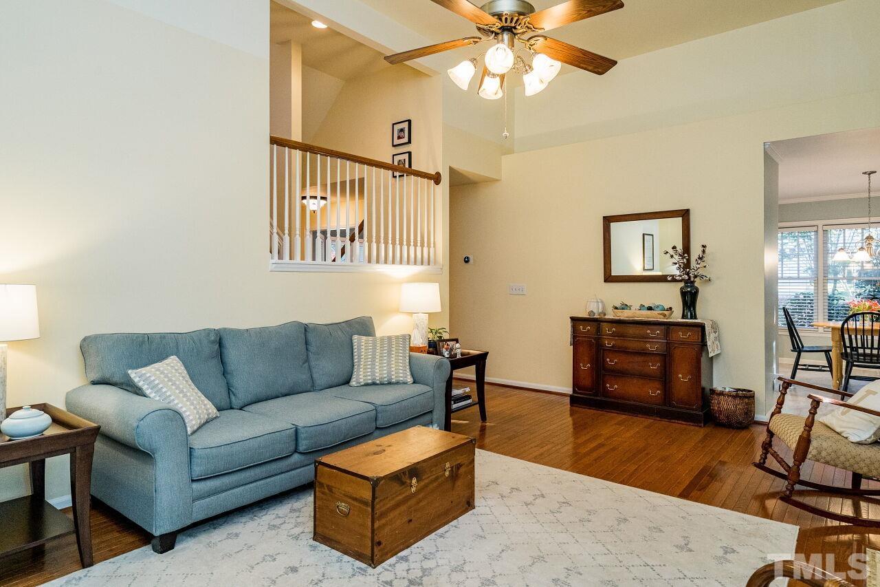2201 Dunlin Lane Raleigh, NC 27614 - Photo 6 of 30 a living room with furniture and a flat screen tv