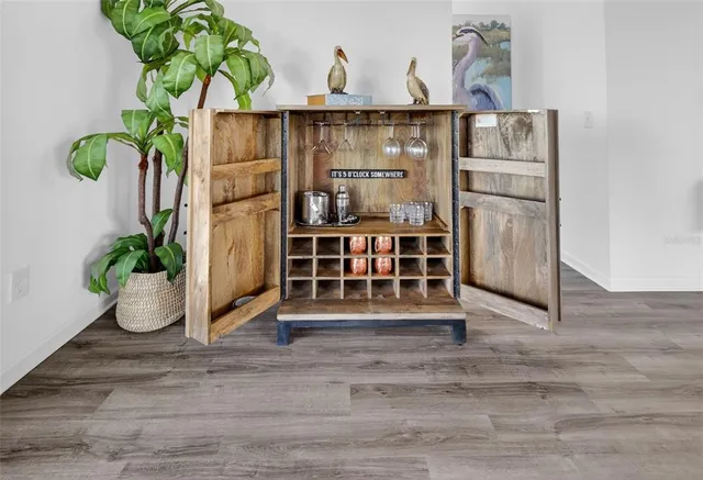 a bedroom with a bed potted plant and a window