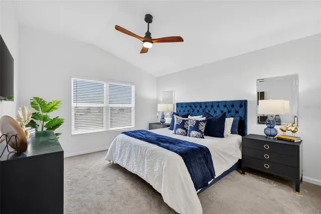 a bedroom with bed and window