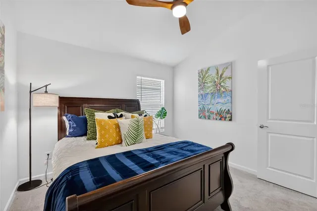 a bathroom with a toilet a sink a mirror and a shower