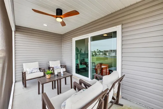 a view of swimming pool with outdoor seating space