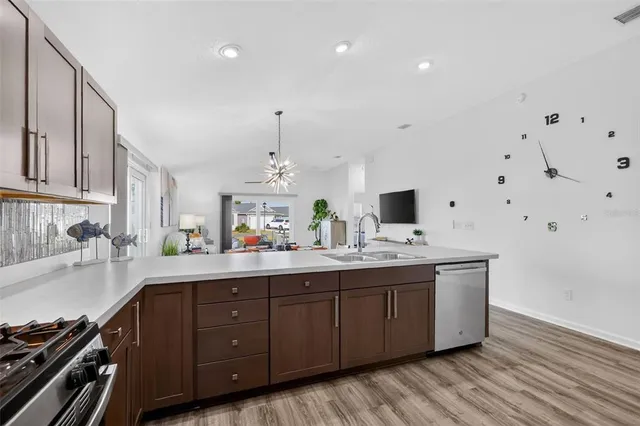a kitchen with a sink and cabinets