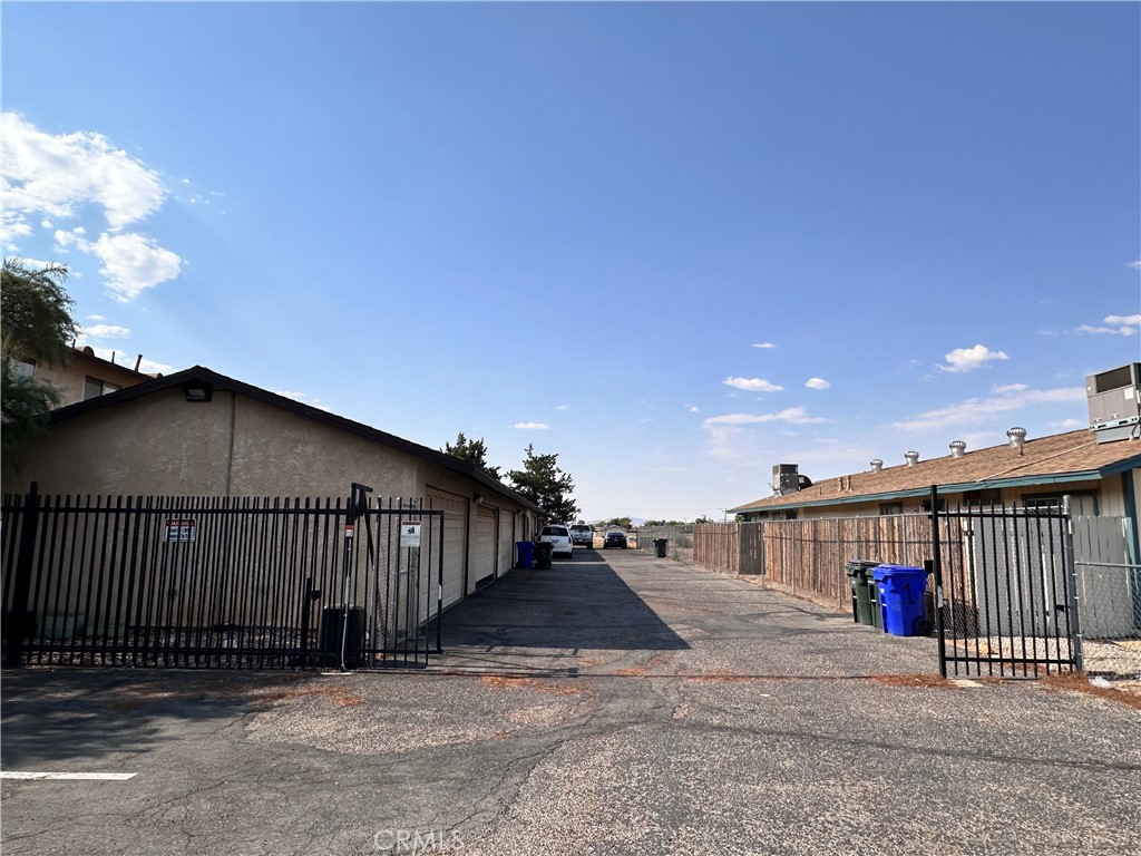 12745 Navajo Road Apple Valley, CA 92308 - Photo 4 of 24 Back Entrance to Garages w/ Security Gate
