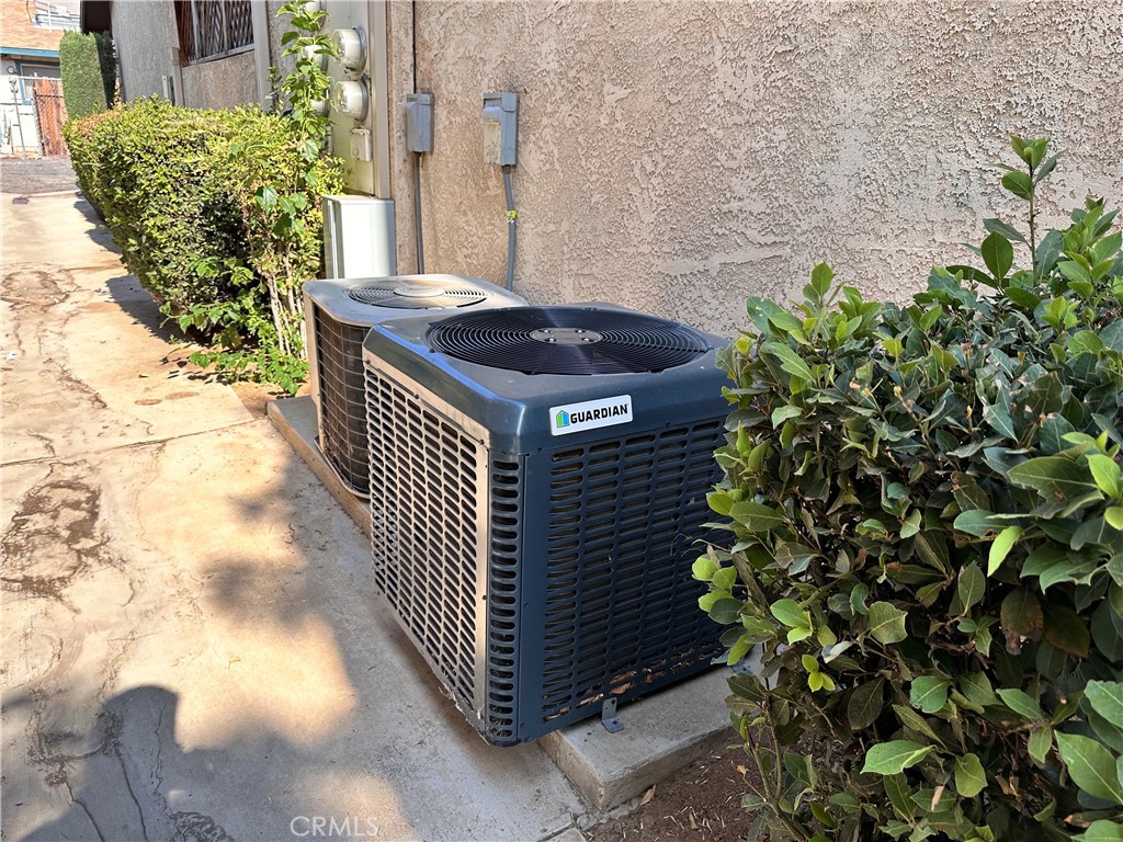 12745 Navajo Road Apple Valley, CA 92308 - Photo 6 of 24 Central A/C Units in the Walkway