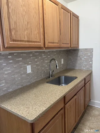 a kitchen with a sink and cabinets