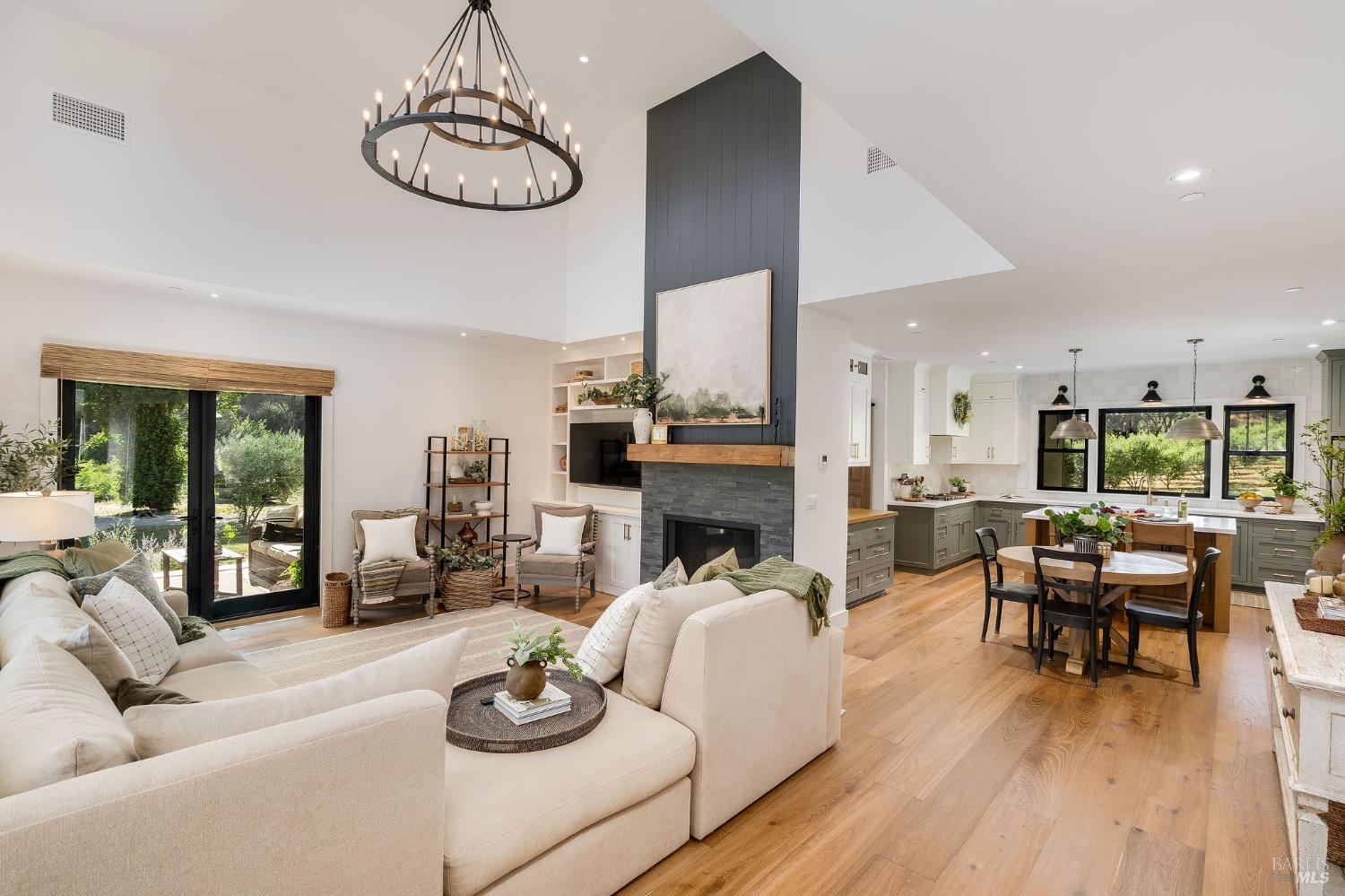 5400 Wragg Canyon Road Napa, CA 94558 - Photo 14 of 68 a living room with fireplace furniture and a wooden floor