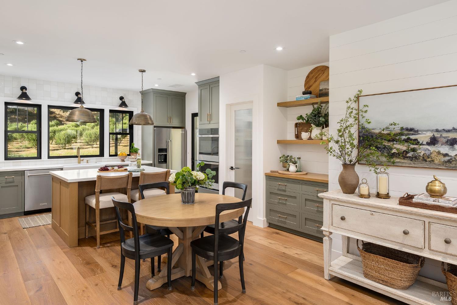 5400 Wragg Canyon Road Napa, CA 94558 - Photo 21 of 68 a kitchen with a table chairs and a refrigerator