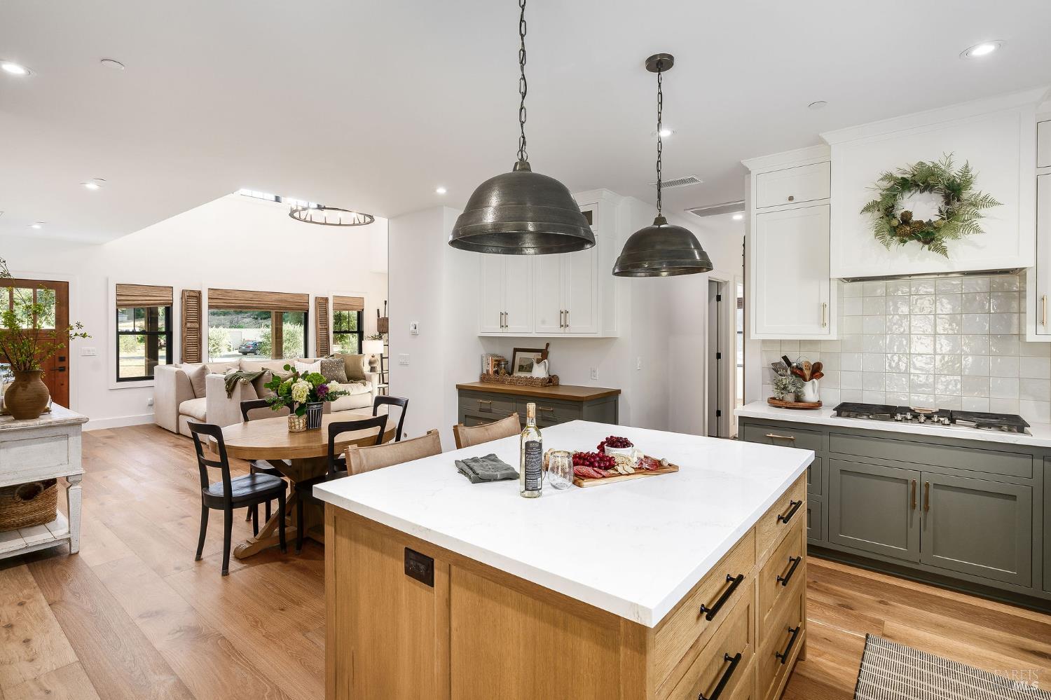 5400 Wragg Canyon Road Napa, CA 94558 - Photo 27 of 68 a kitchen with stainless steel appliances kitchen island granite countertop a stove a sink a dining table and chairs