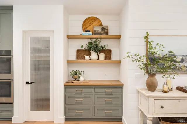 a bathroom with a double vanity sink mirror and bathtub