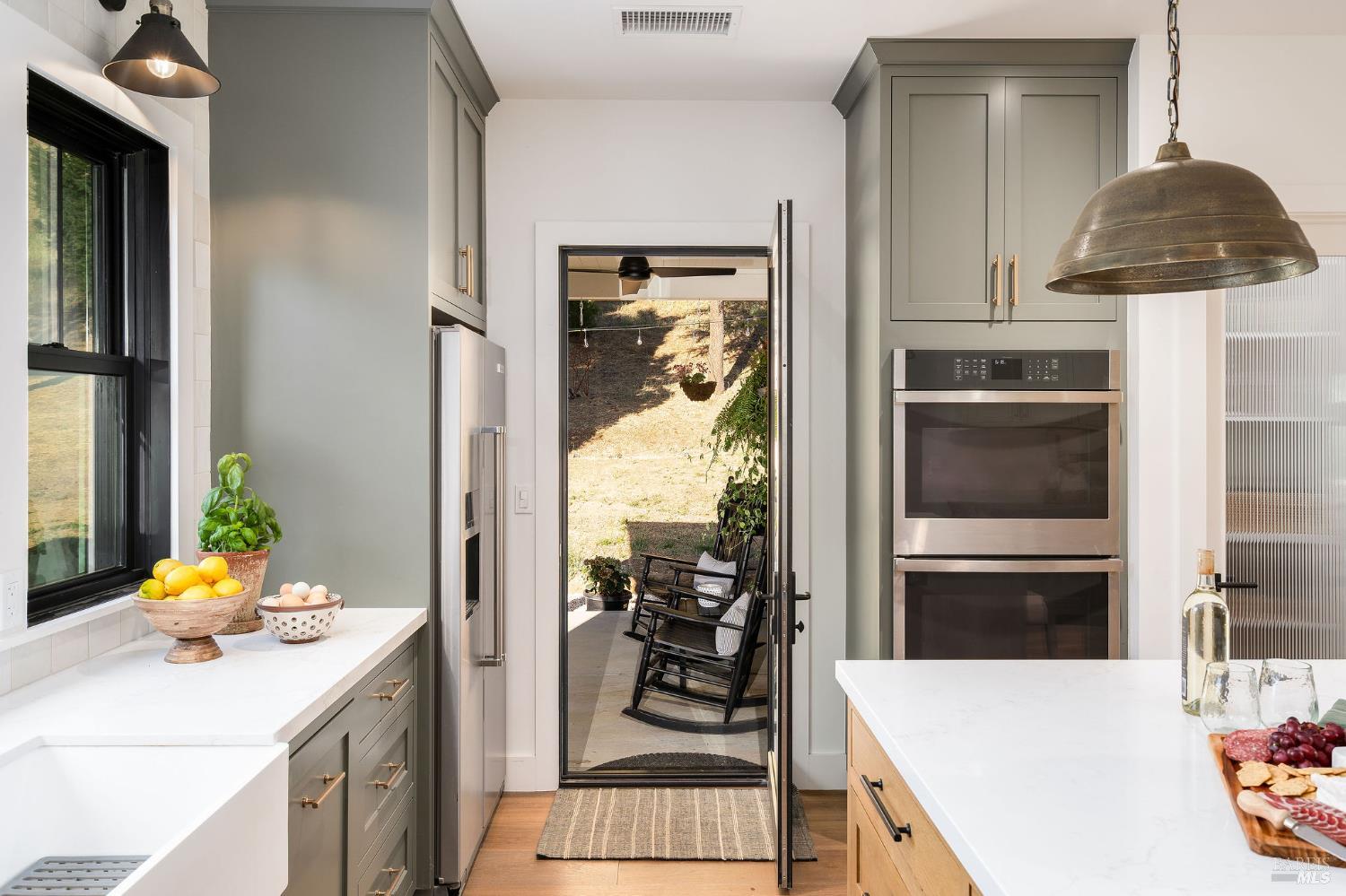 5400 Wragg Canyon Road Napa, CA 94558 - Photo 30 of 68 a kitchen with a sink and cabinets