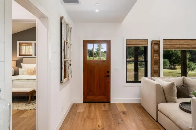 a bathroom with a toilet a sink and a mirror