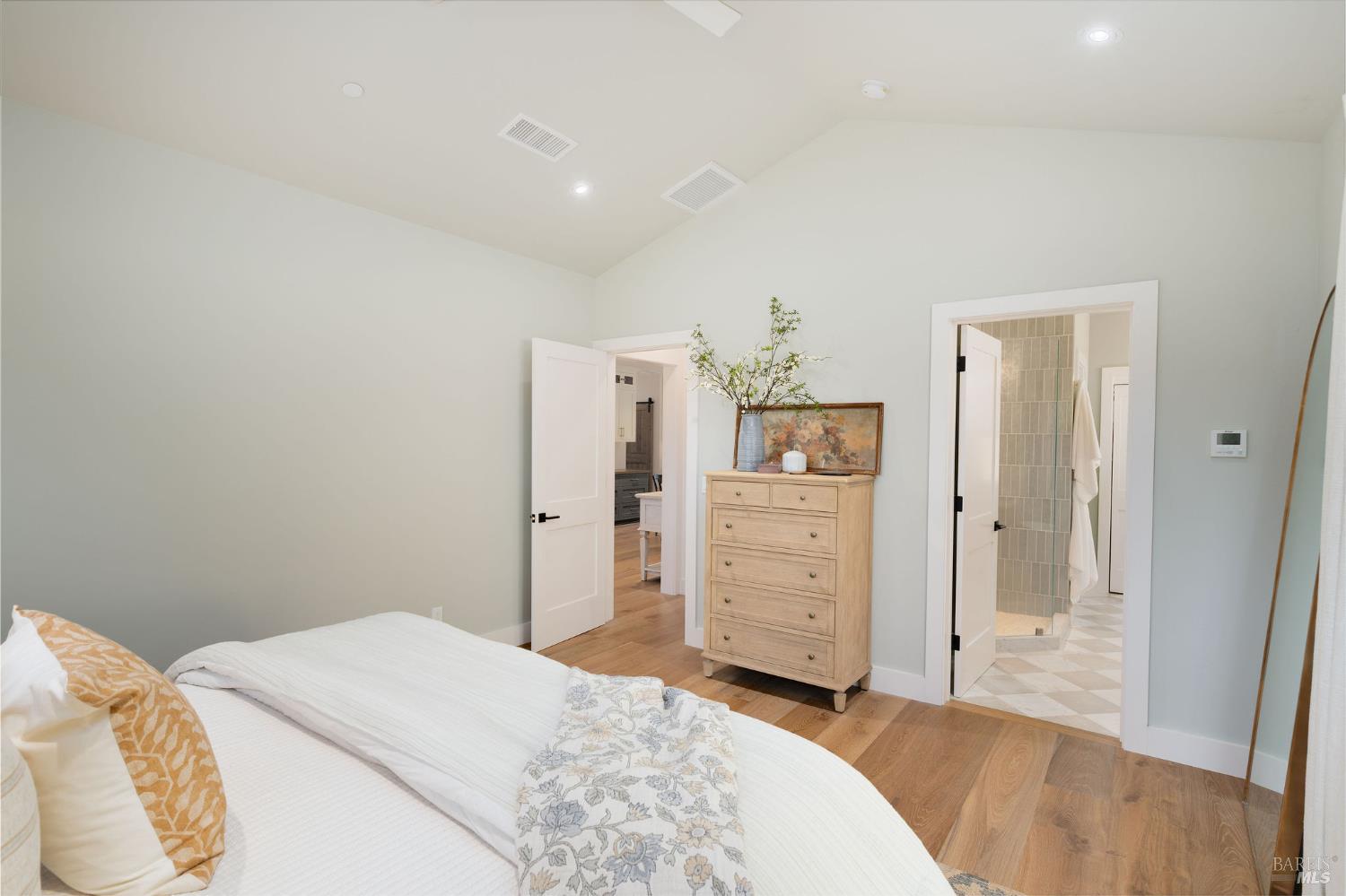 5400 Wragg Canyon Road Napa, CA 94558 - Photo 35 of 68 a bedroom with a bed and wooden floor