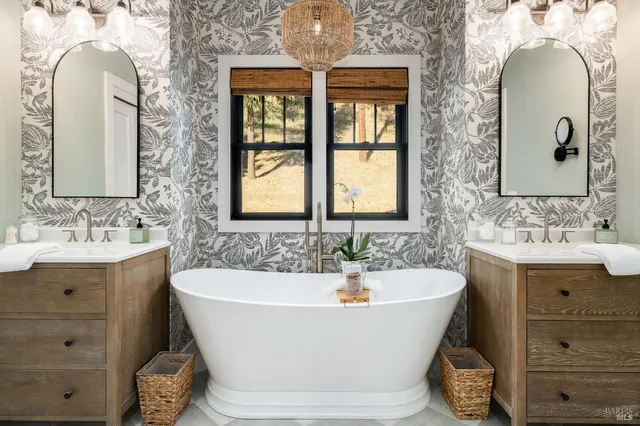 a bathroom with a sink vanity and a mirror