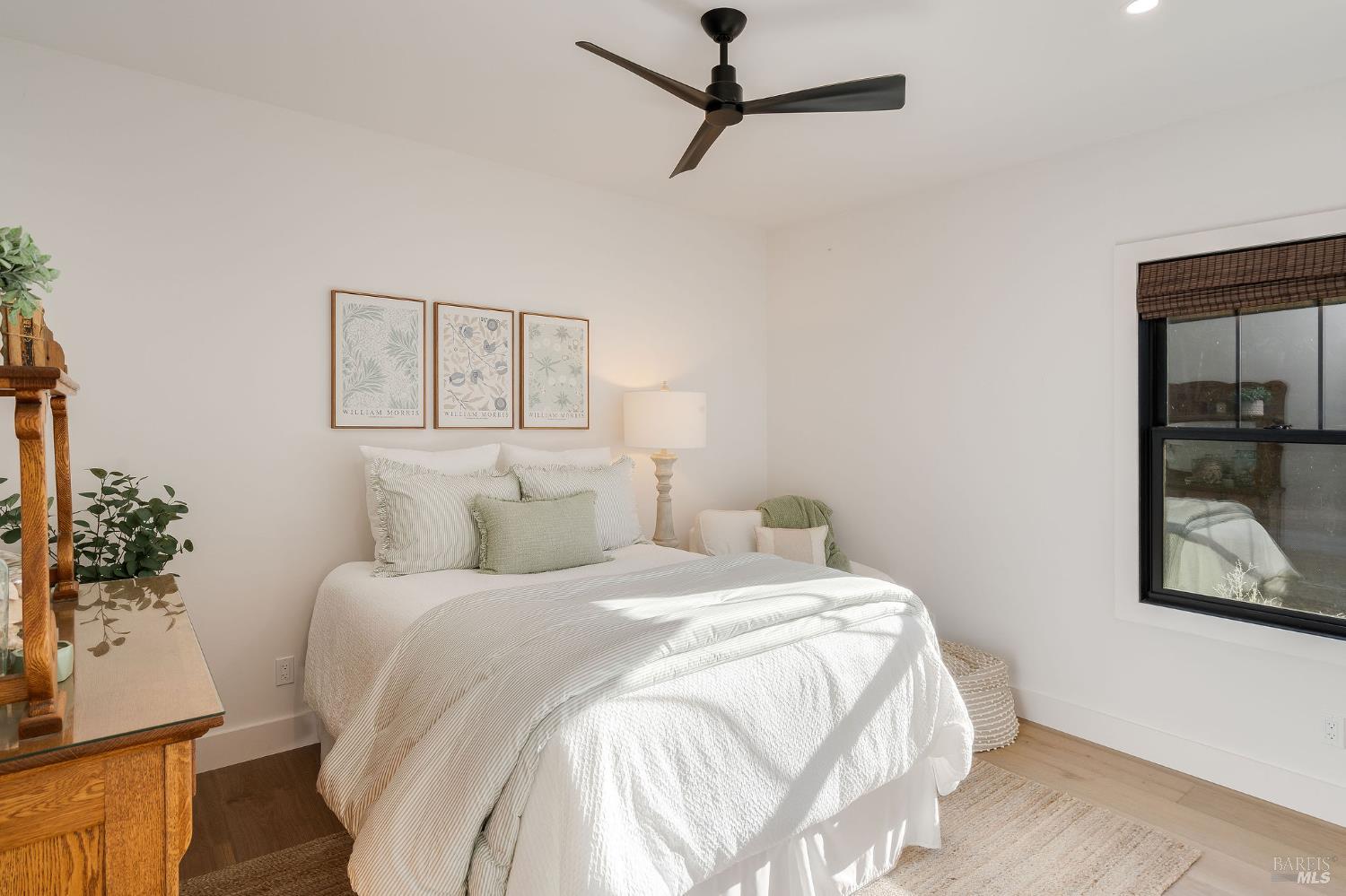 5400 Wragg Canyon Road Napa, CA 94558 - Photo 42 of 68 a bedroom with a large bed and a potted plant