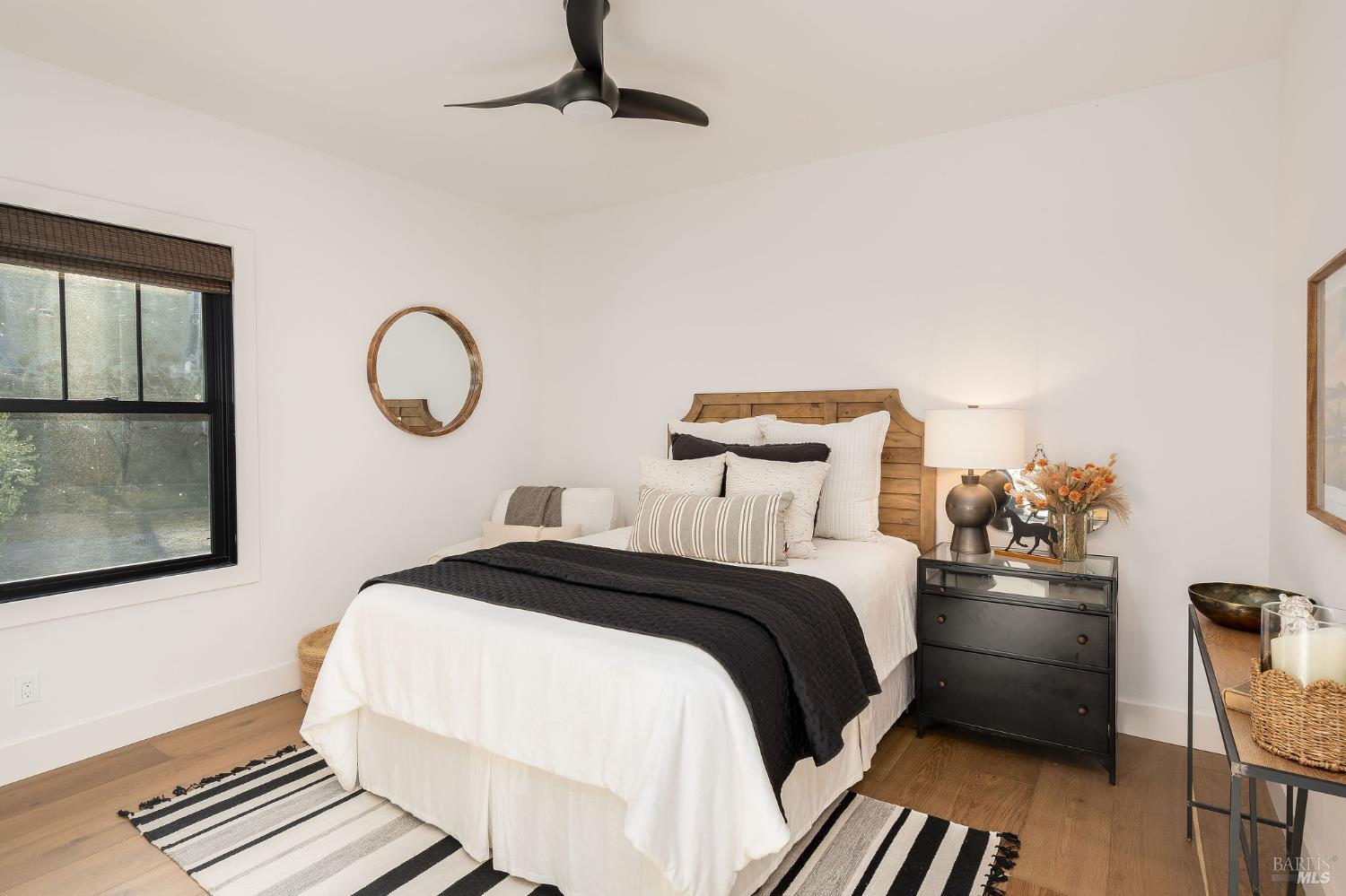 5400 Wragg Canyon Road Napa, CA 94558 - Photo 45 of 68 a bedroom with a bed and wooden floor