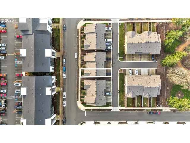 a picture of a brick building next to a road