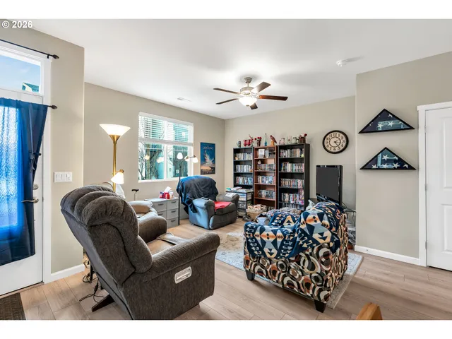 a living room with furniture a couch and a table