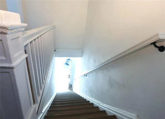 a view of a hallway with staircase