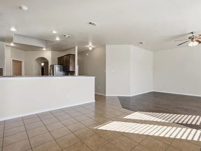a view of a living room and kitchen