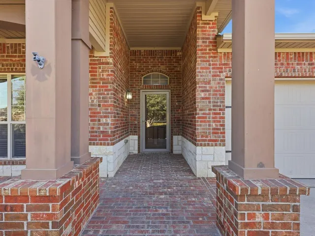 a view of front door of house with stairs