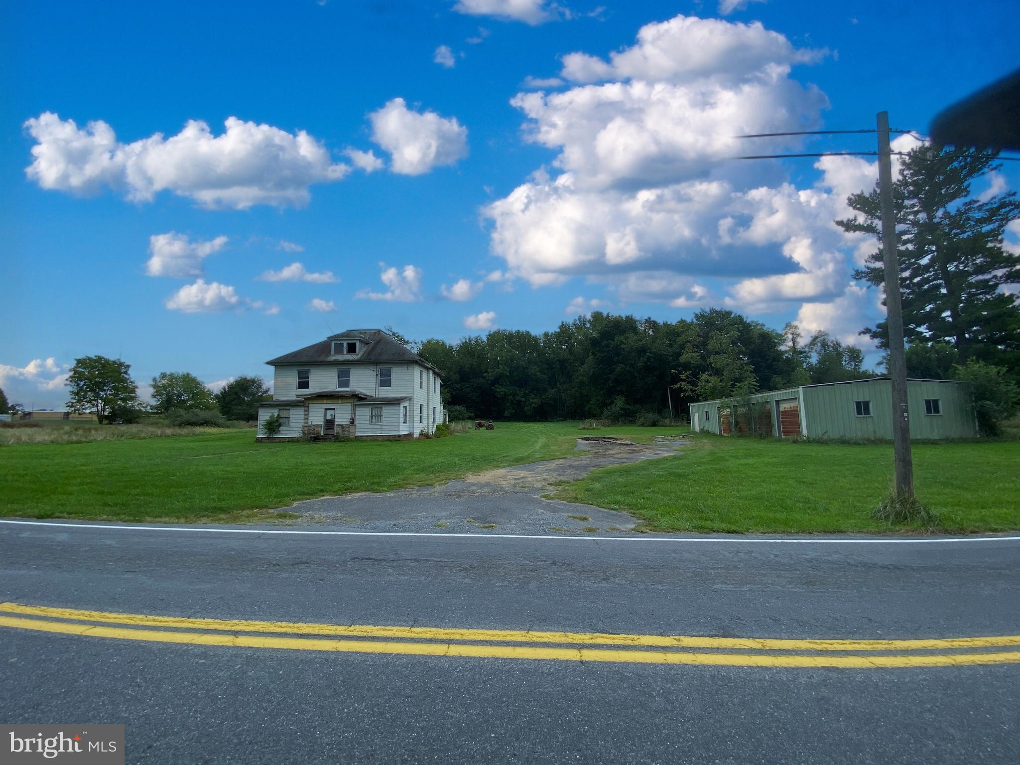 1040 Cider Press Road Chambersburg, PA 17202 - Photo 1 of 10 a view of a house with a big yard and a large tree