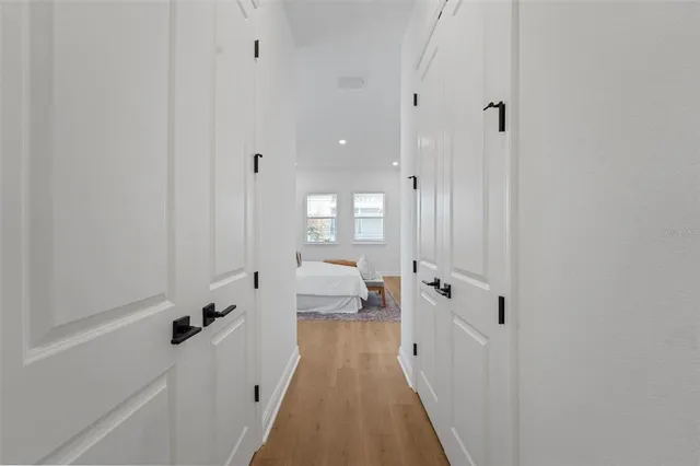 a hallway with white doors