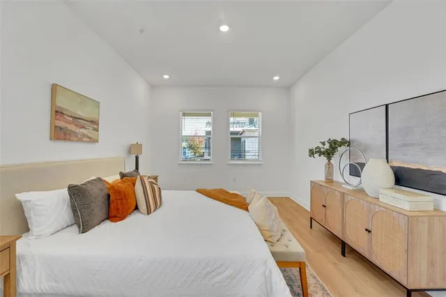 a bedroom with bed and window