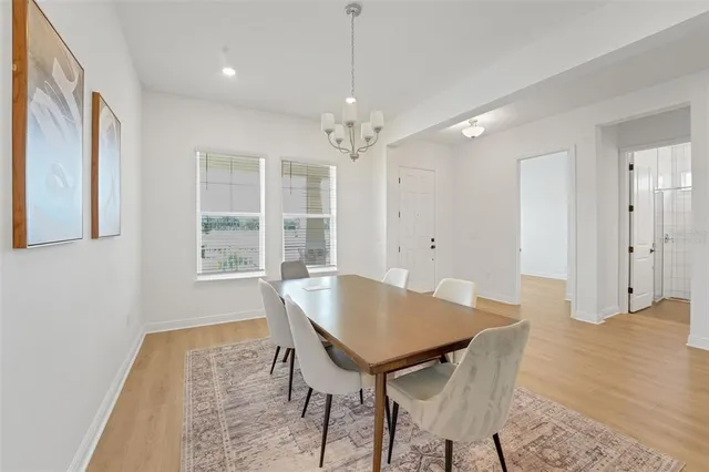 a view of a dining room with furniture and window